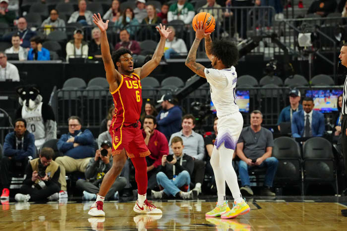 USC Trojans guard Bronny James defends Washington Huskies guard Koren Johnson.
